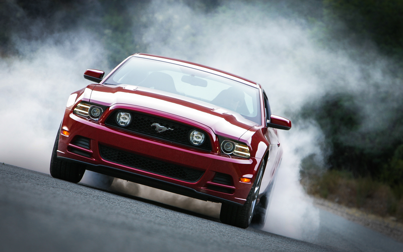 Illustration for article titled Oppositelock Review: '15 WRX STI vs '13 Mustang GT 5.0